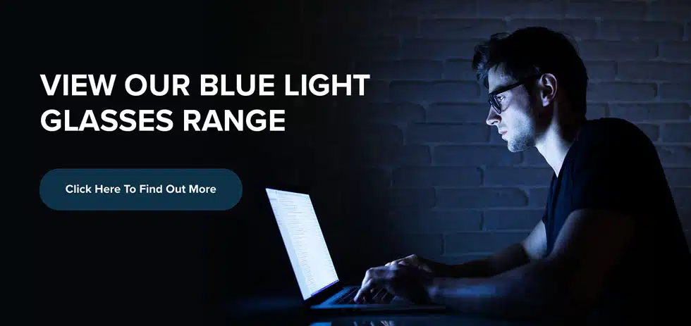 man at laptop in blue light glasses