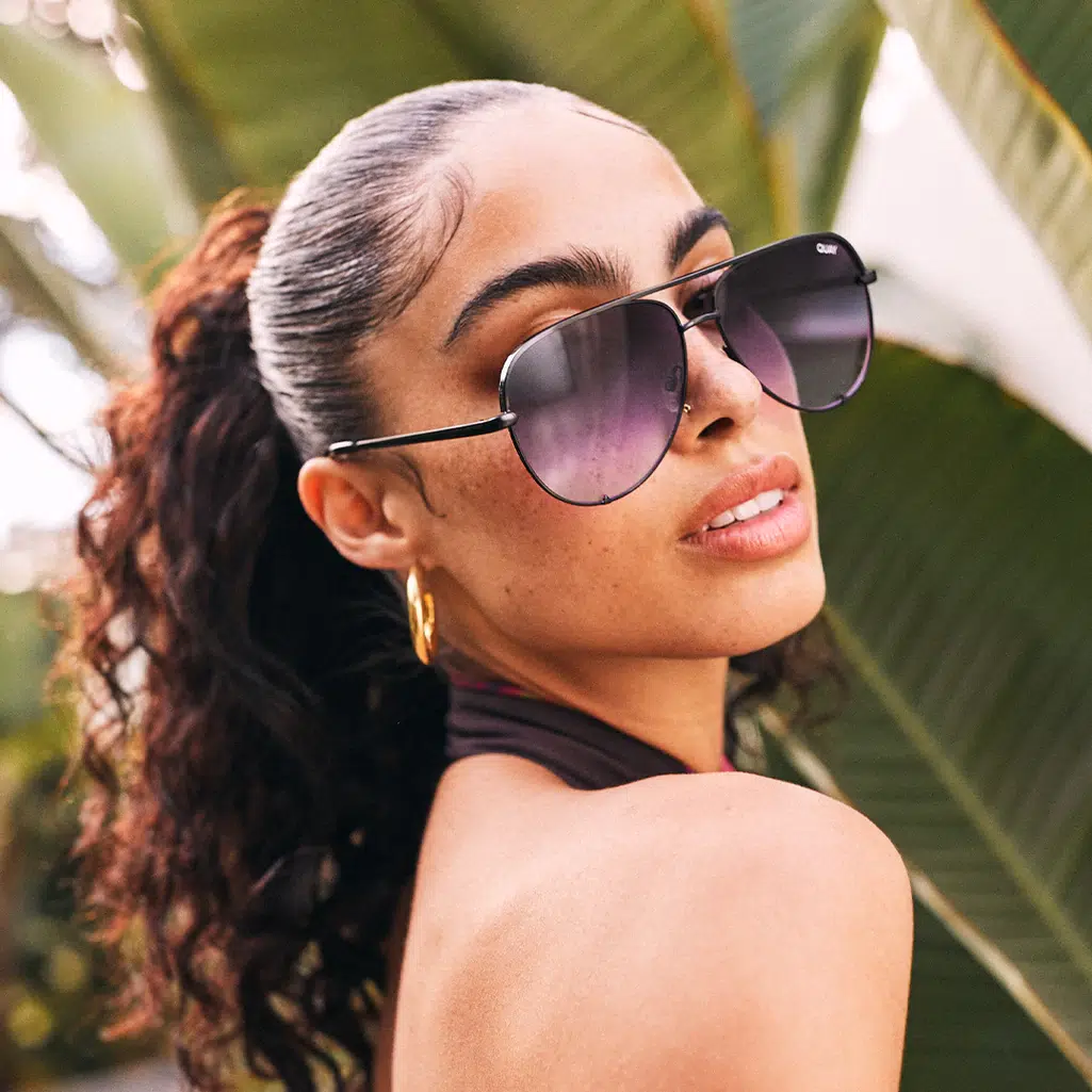 Woman wearing Quay Australia sunglasses with gradient lenses