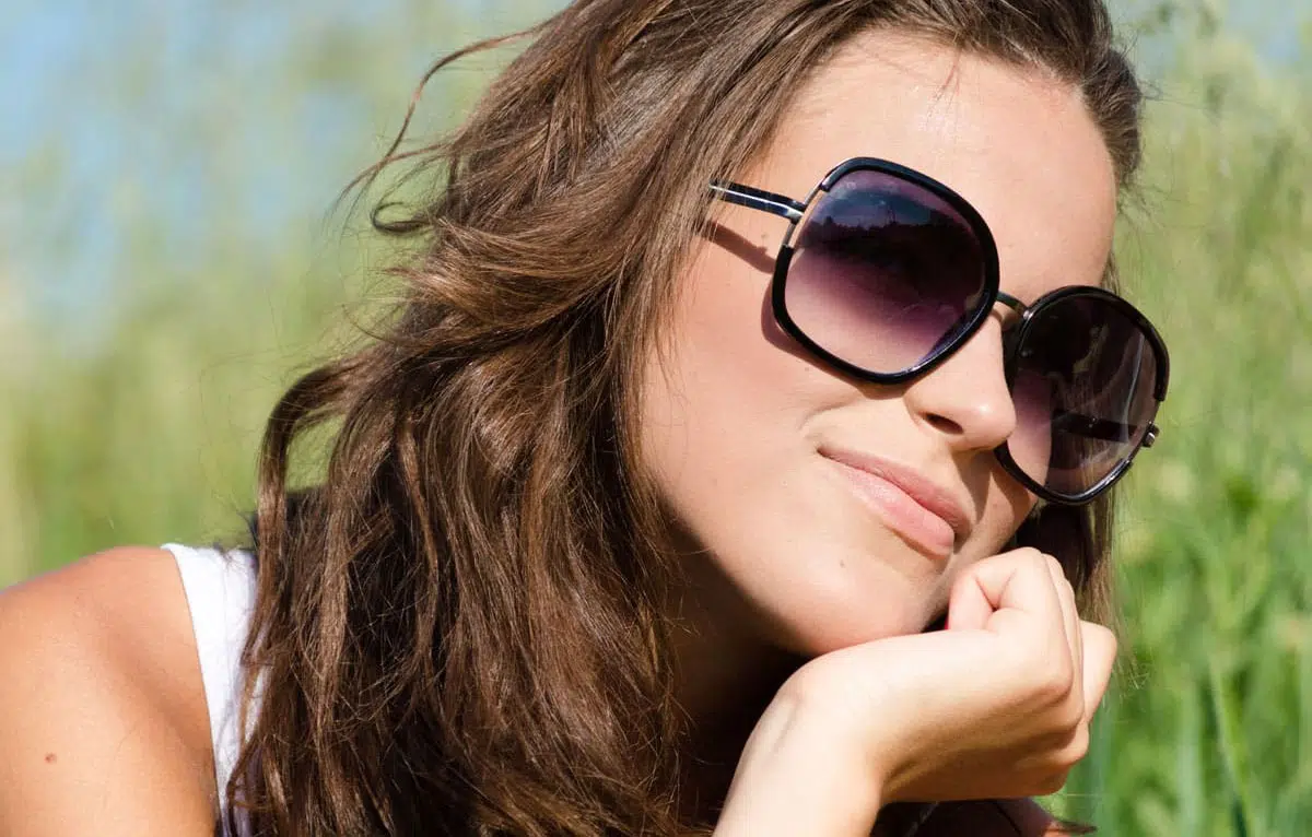 Woman wearing a pair of gradient lens sunglasses