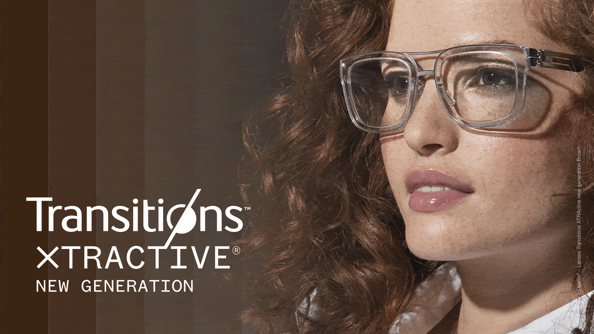 Woman wearing glasses with transitions® lenses
