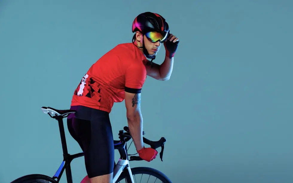 A cyclist wearing prescription cycling glasses