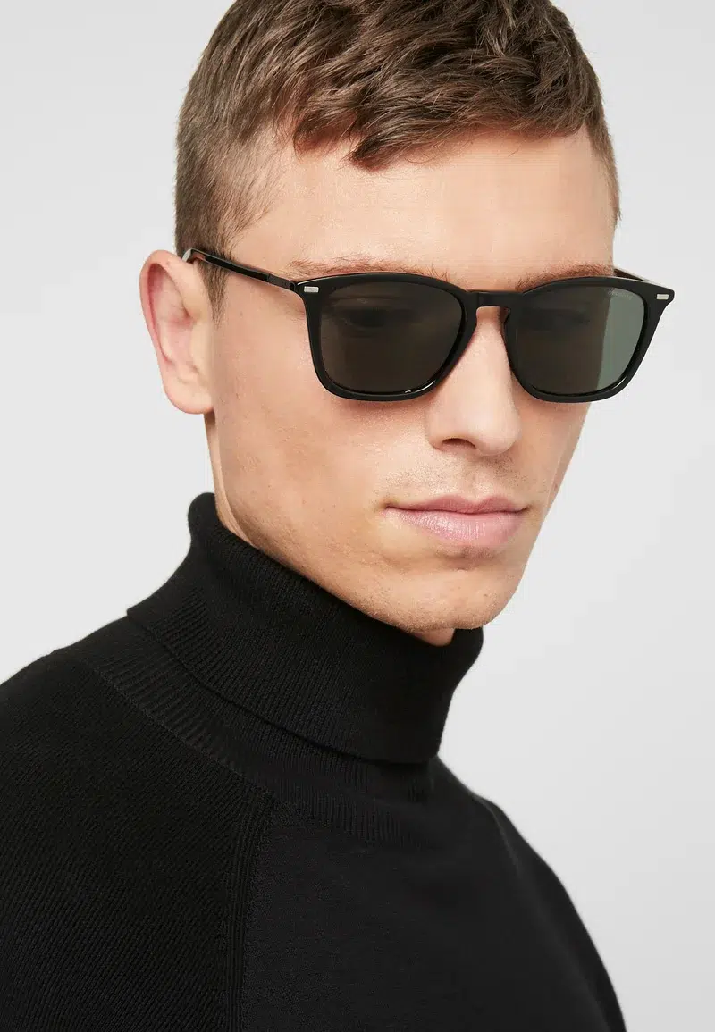A man wearing Polaroid eyewear sunglasses