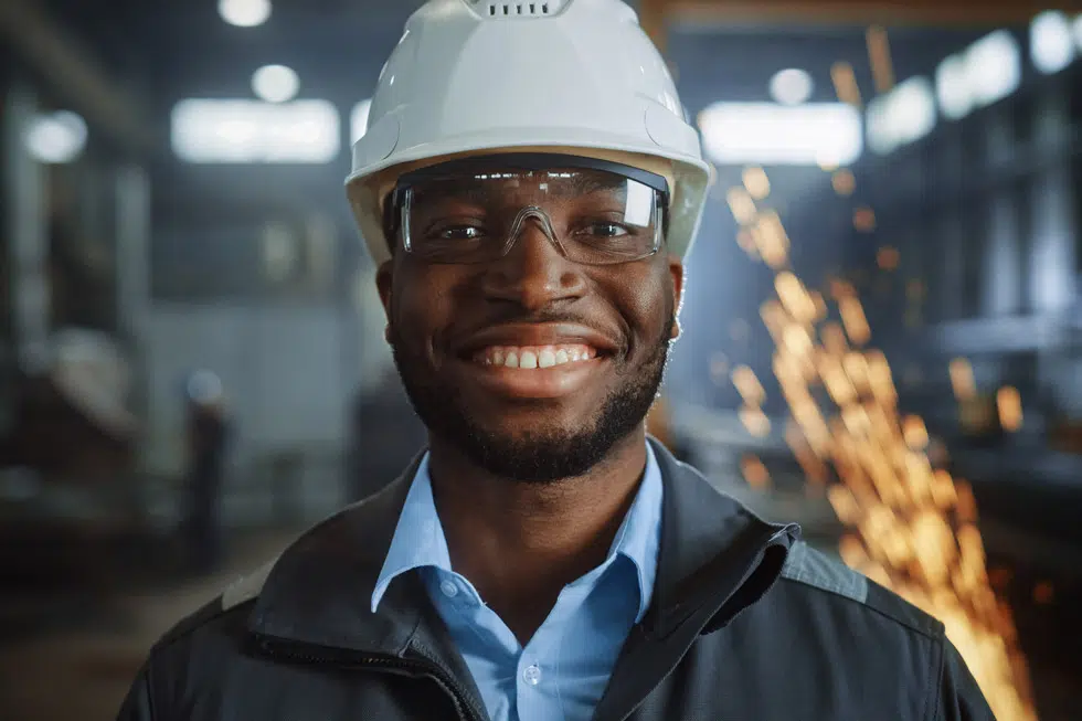 A person wearing construction safety glasses