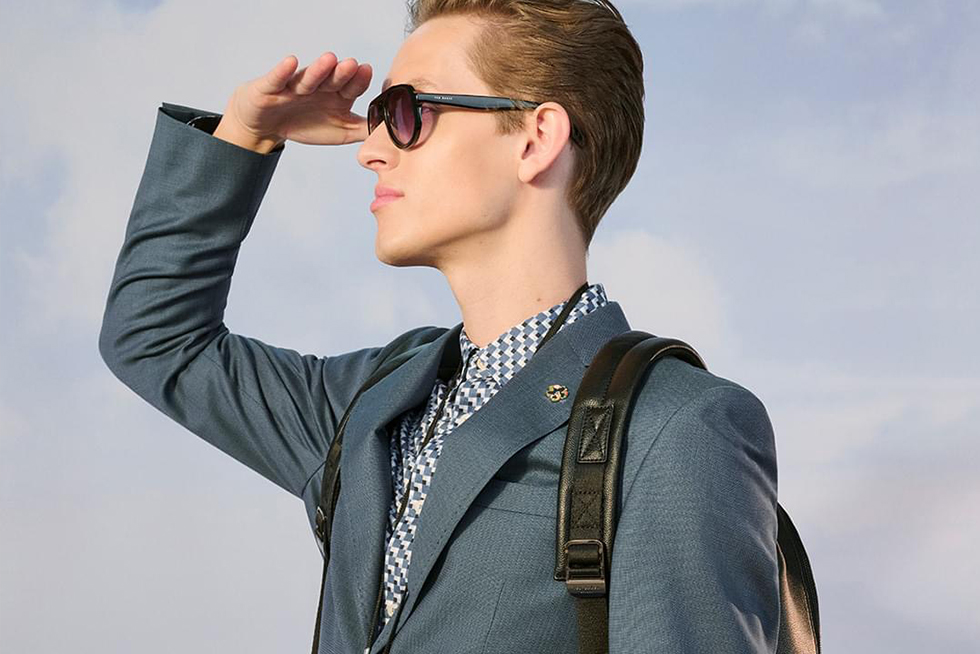 a person wearing stylish Ted Baker sunglasses with replacement lenses