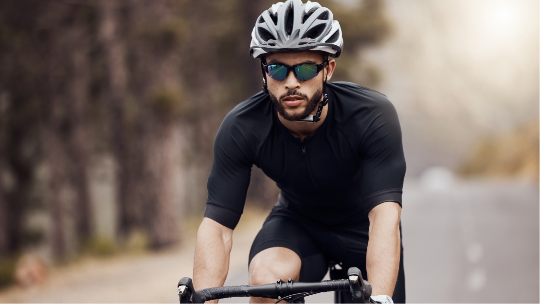 cyclist-with-glasses A person wearing a glasses with Transitions® lenses