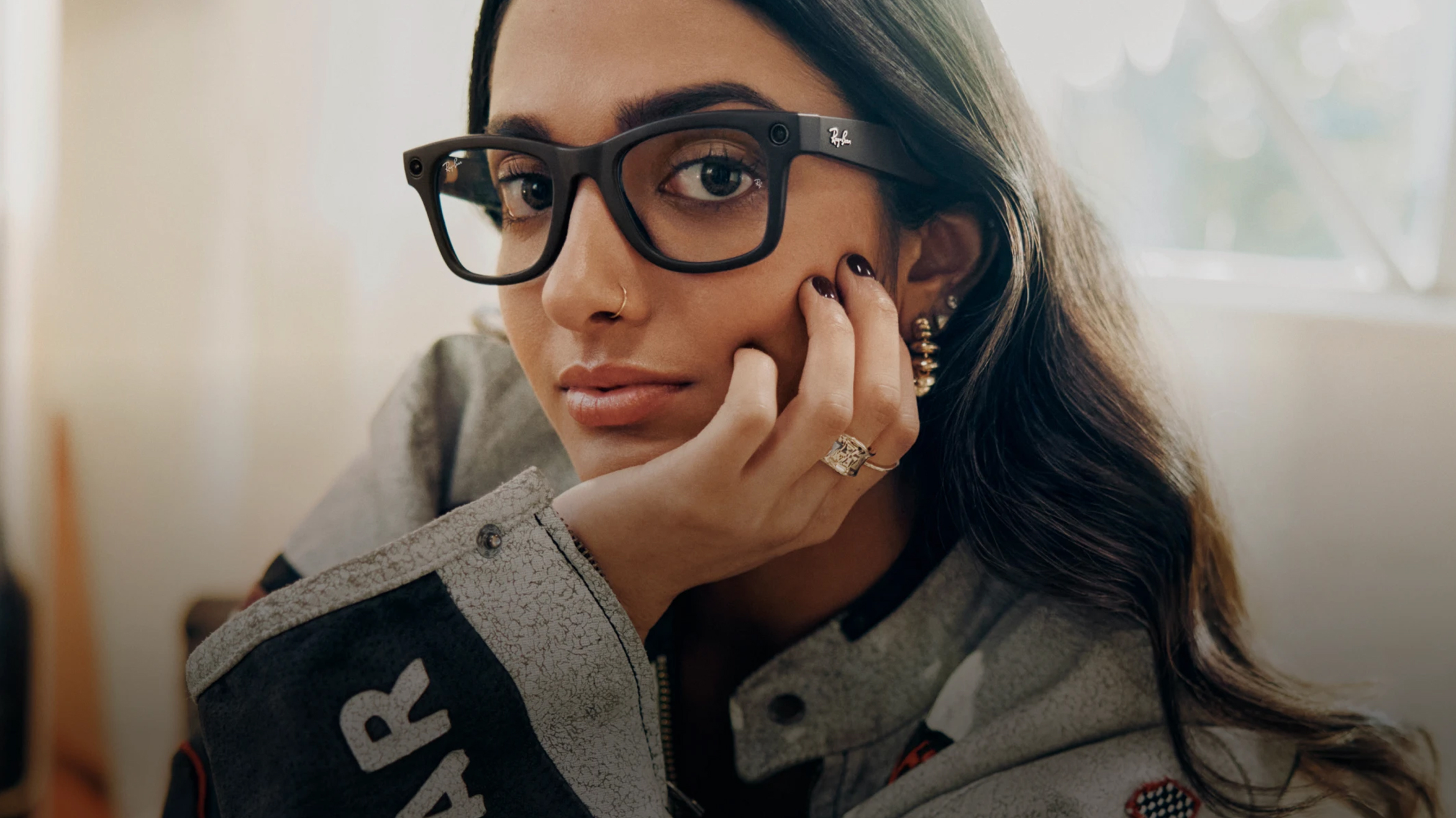 A person wearing a glasses with Transitions® lenses
