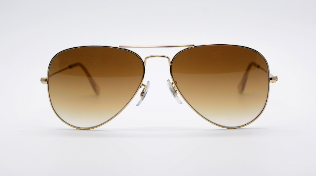Close up of a pair of aviator sunglasses isolated