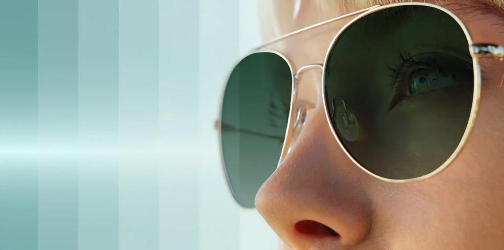 Woman wearing Transitions® XTRActive® lenses