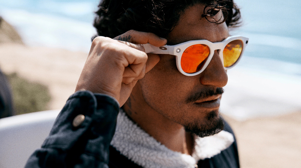 Man posing wearing Oakley Meta glasses