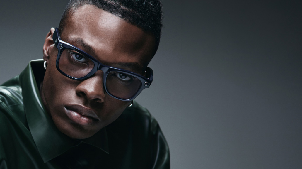 Man wearing stylish Ray-Ban Meta glasses, serious expression