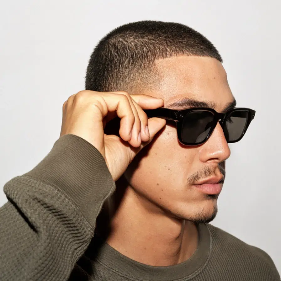 A person wearing a glasses with Transitions® lenses