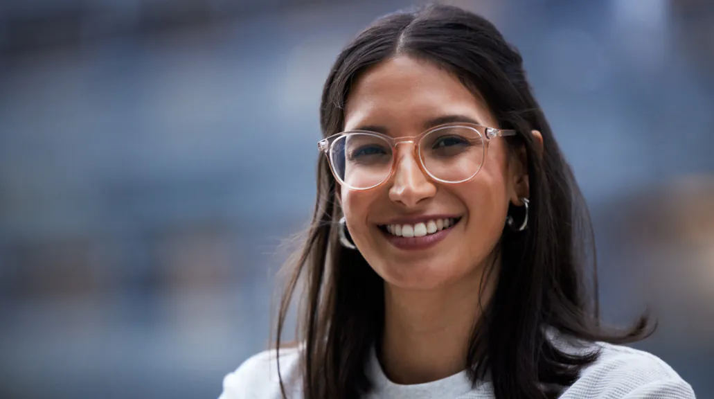 Portrait of woman smiling with glasses in closeup