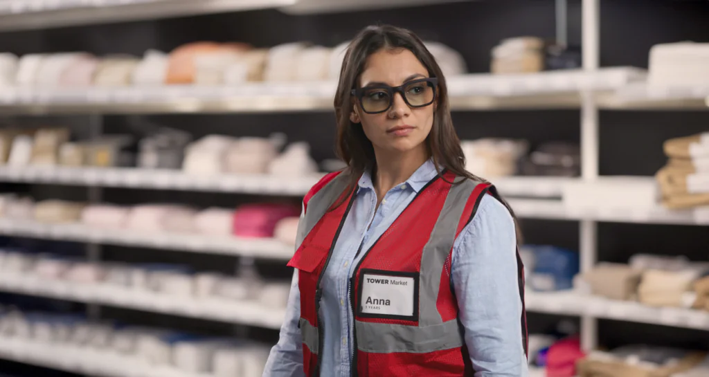 Woman wearing Vuzix Z100 smart glasses in a store